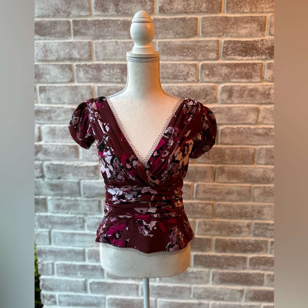 This Karl Lagerfeld top. Runs small. Button detail. Snaps to keep on bra.